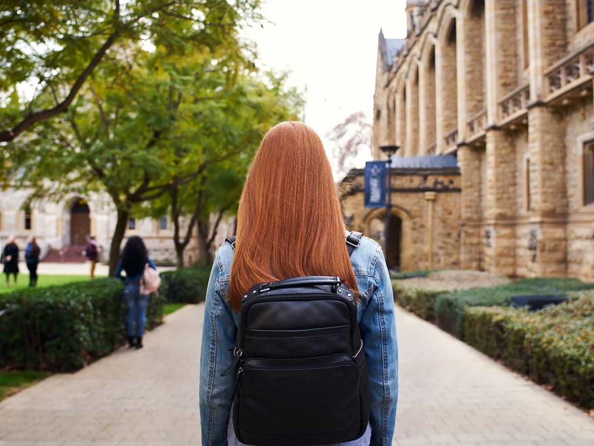 A student carrying a backpack